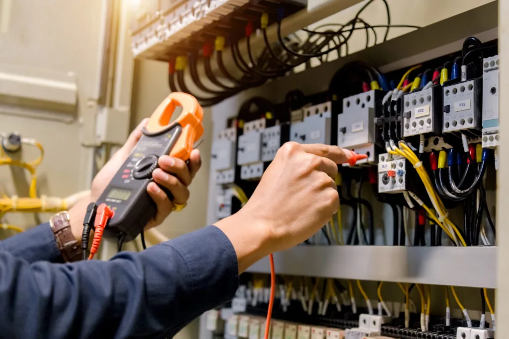 Electrician inspecting voltage